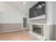 Living room showcasing wood floors and a cozy fireplace with a mounted television at 1836 N Stapley Dr # 191, Mesa, AZ 85203
