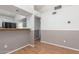 The open living room offers wood floors, half wall and entry to kitchen at 1836 N Stapley Dr # 191, Mesa, AZ 85203