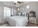 Bright bedroom featuring a large window, neutral walls, and a comfortable bed creating a serene retreat at 20557 W Lost Creek Dr, Buckeye, AZ 85396