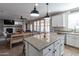 Open-concept kitchen with a large island, granite countertops, stainless steel appliances, and pendant lighting at 20557 W Lost Creek Dr, Buckeye, AZ 85396
