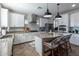 Spacious kitchen featuring a central island, stainless steel appliances, granite countertops and pendant lights at 20557 W Lost Creek Dr, Buckeye, AZ 85396