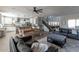 Open-concept living area with staircase, fireplace, and a dining space adjacent to the kitchen at 20557 W Lost Creek Dr, Buckeye, AZ 85396