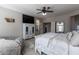 Comfortable main bedroom features ample natural light, a TV, and a cozy sitting area at 20557 W Lost Creek Dr, Buckeye, AZ 85396