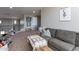 Spacious playroom featuring a gray couch, neutral walls, and a cozy area for activities at 20557 W Lost Creek Dr, Buckeye, AZ 85396