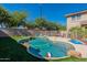 Inviting backyard pool area with an artificial turf and a view of the home at 20557 W Lost Creek Dr, Buckeye, AZ 85396