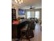 Cozy living room featuring a ceiling fan, a large TV, neutral paint, and comfortable seating at 2111 N 77Th Gln, Phoenix, AZ 85035