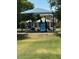 Neighborhood playground featuring a jungle gym, blue slide, and sunshade at 2111 N 77Th Gln, Phoenix, AZ 85035
