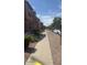 Attractive townhome community with sidewalks, landscaping, and convenient street parking at 2111 N 77Th Gln, Phoenix, AZ 85035