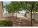Private backyard featuring mature trees and a stone paver pathway and border at 2189 E Ranch Ct, Gilbert, AZ 85296