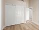 Bedroom showcasing a large closet, wood-look floors, white trim, and light neutral paint at 2189 E Ranch Ct, Gilbert, AZ 85296