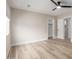 Bright bedroom featuring a ceiling fan, neutral paint, walk-in closet, and new wood-look floors at 2189 E Ranch Ct, Gilbert, AZ 85296