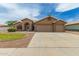 Inviting single-story home featuring a three-car garage and low-maintenance desert landscaping at 2189 E Ranch Ct, Gilbert, AZ 85296