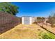Backyard featuring a storage shed, gravel areas, and some grass at 22615 N 31St Dr, Phoenix, AZ 85027