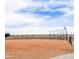 Community baseball field provides recreation with backstop, surrounded by open space and blue skies at 22615 N 31St Dr, Phoenix, AZ 85027