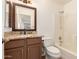 Bathroom featuring vanity with granite countertop, mirror, bathtub, and toilet at 22615 N 31St Dr, Phoenix, AZ 85027