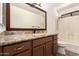 Bathroom featuring an undermount sink, tile floor, and shower at 22615 N 31St Dr, Phoenix, AZ 85027
