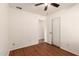 Bedroom featuring a ceiling fan, access to a doorway, and closet at 22615 N 31St Dr, Phoenix, AZ 85027