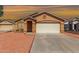 Inviting single-story home with a two-car garage and desert landscaping at 22615 N 31St Dr, Phoenix, AZ 85027