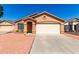 Charming single-story home with a two-car garage and low maintenance desert landscaping offers curb appeal at 22615 N 31St Dr, Phoenix, AZ 85027
