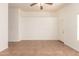 Bright living room featuring tile flooring, ceiling fan, and lots of natural light at 22615 N 31St Dr, Phoenix, AZ 85027