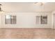 Bright living room featuring tile flooring, natural light, and neutral walls at 22615 N 31St Dr, Phoenix, AZ 85027