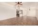 Bright living space with tile flooring and open access to the kitchen area at 22615 N 31St Dr, Phoenix, AZ 85027