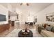 Open-concept living space with a sofa, dining table and kitchen area at 22615 N 31St Dr, Phoenix, AZ 85027