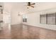 Open living space with tile floors, ceiling fan, and large windows at 22615 N 31St Dr, Phoenix, AZ 85027
