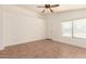 Unfurnished room with tile flooring, a ceiling fan and a window at 22615 N 31St Dr, Phoenix, AZ 85027