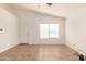 Unfurnished room with tile flooring, a ceiling fan and a window at 22615 N 31St Dr, Phoenix, AZ 85027
