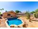 Inviting backyard pool with desert landscape and sunny patio area, perfect for outdoor relaxation and entertaining at 22615 N 31St Dr, Phoenix, AZ 85027
