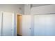 Bedroom featuring multiple doors and closets with white doors at 2301 E University Dr # 334, Mesa, AZ 85213