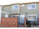 Inviting exterior of a two-story home with fresh paint and a secure gated front entrance at 2301 E University Dr # 334, Mesa, AZ 85213