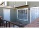 This cozy front porch features an outdoor storage unit and a secure gated entrance to the home at 2301 E University Dr # 334, Mesa, AZ 85213