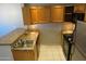 Kitchen area with stainless steel appliances, tile floor, and updated countertops at 2301 E University Dr # 334, Mesa, AZ 85213