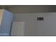 Close-up on a gray wall with a white cabinet and an air vent at 2301 E University Dr # 334, Mesa, AZ 85213
