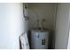 Close-up of a water heater unit inside a utility closet at 2301 E University Dr # 334, Mesa, AZ 85213