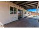 Covered back patio featuring glass doors and ample space for outdoor seating and entertainment near the pool at 2339 W Ponderosa Ln, Phoenix, AZ 85023