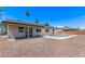 Expansive backyard features a refreshing pool, gravel landscaping, and a covered patio, perfect for outdoor enjoyment at 2339 W Ponderosa Ln, Phoenix, AZ 85023