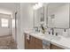 Stylish bathroom featuring a double sink vanity with modern faucets and an elegant decor at 2339 W Ponderosa Ln, Phoenix, AZ 85023