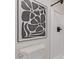 Close up of modern bathroom decor with gray floral art and a white shower-tub combo at 2339 W Ponderosa Ln, Phoenix, AZ 85023