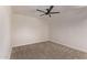 Clean and spacious bedroom with neutral carpeting and a ceiling fan at 2339 W Ponderosa Ln, Phoenix, AZ 85023