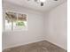 Bedroom with plush carpet and a large window offering ample natural light and views at 2339 W Ponderosa Ln, Phoenix, AZ 85023