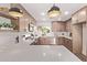 Well-lit kitchen with stainless steel appliances, custom cabinets and Quartz countertops at 2339 W Ponderosa Ln, Phoenix, AZ 85023