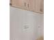 Clean laundry area with light wood cabinets, white walls, and modern hookups for a washer and dryer at 2339 W Ponderosa Ln, Phoenix, AZ 85023