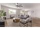 Bright living room with light hardwood floors, stylish furniture, and lots of natural light at 2339 W Ponderosa Ln, Phoenix, AZ 85023