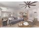 Open concept living area with hardwood floors, neutral decor, and ample seating at 2339 W Ponderosa Ln, Phoenix, AZ 85023