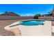 Backyard pool with diving board, set against gravel landscaping and a privacy fence, invites summer relaxation at 2339 W Ponderosa Ln, Phoenix, AZ 85023
