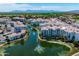 Expansive aerial view showcasing a community with water features and well-maintained landscaping at 2511 W Queen Creek Rd # 116, Chandler, AZ 85248