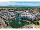 Panoramic aerial view of the property highlighting the complex, water features, and lush surroundings at 2511 W Queen Creek Rd # 116, Chandler, AZ 85248